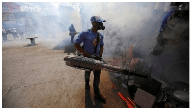 Municipal worker fumigates a market to prevent the spread of dengue fever in Tegucigalpa, Honduras, July 25, 2019.